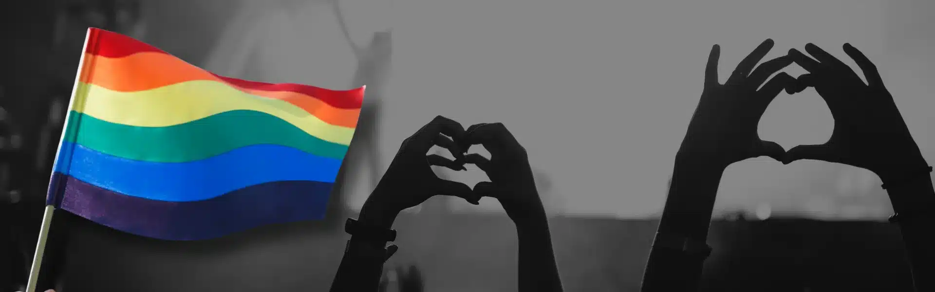 banner voor de pride kalender in Nederland met hierop de regenboogvlag met daarnaast twee "love-hands", handen die een hartje vormen.